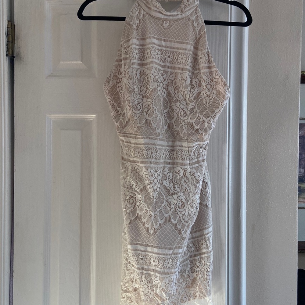 Super feminine mini dress. Lace has no tears and dress is in good condition.
